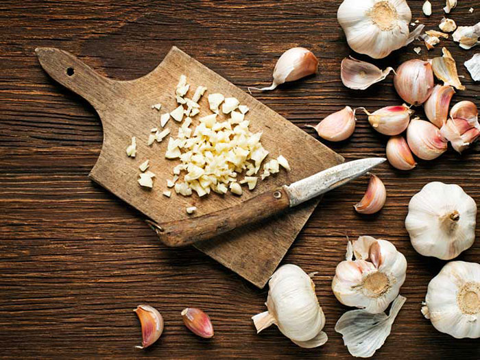 Garlic on a wooden chopping board